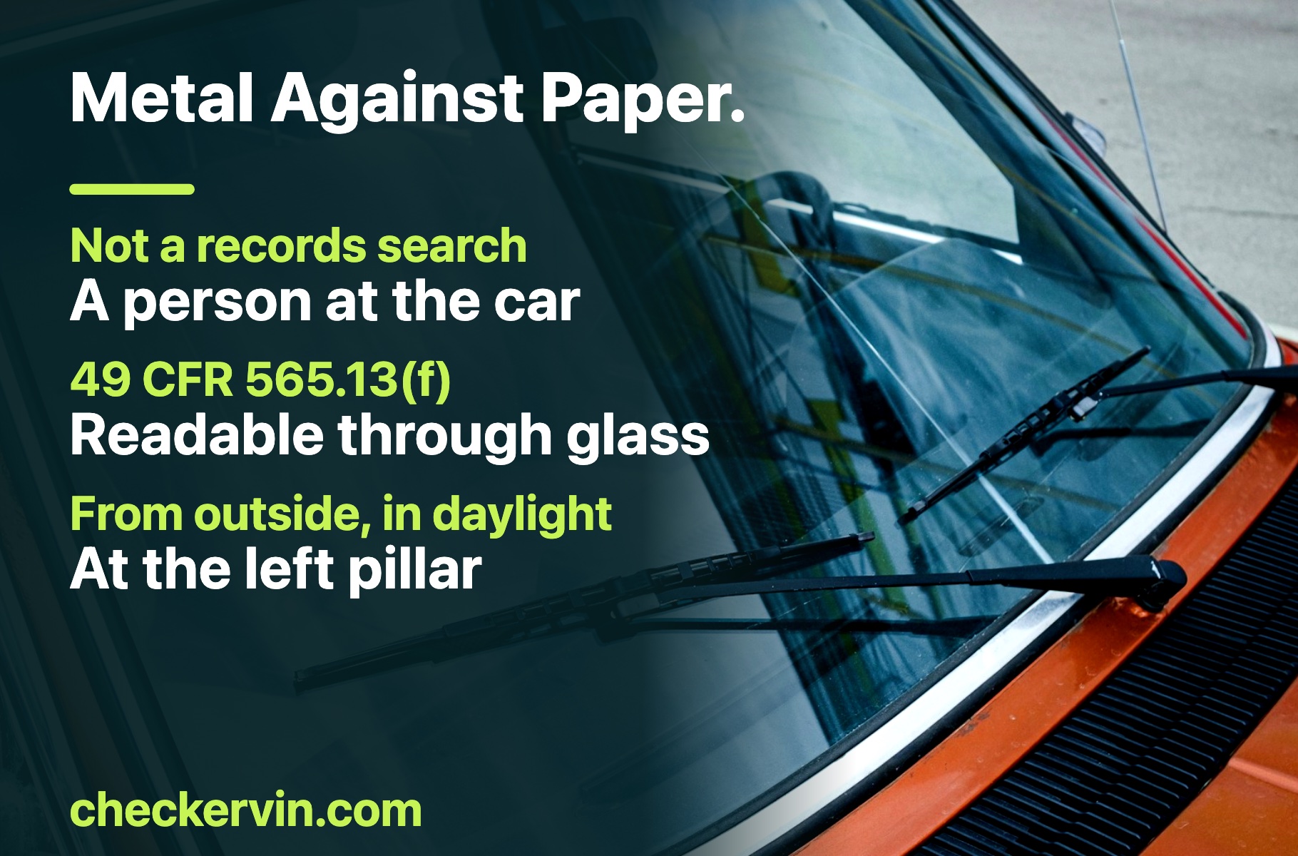 A windshield seen from outside at the base of the left pillar, where the federal standard requires the VIN to be readable